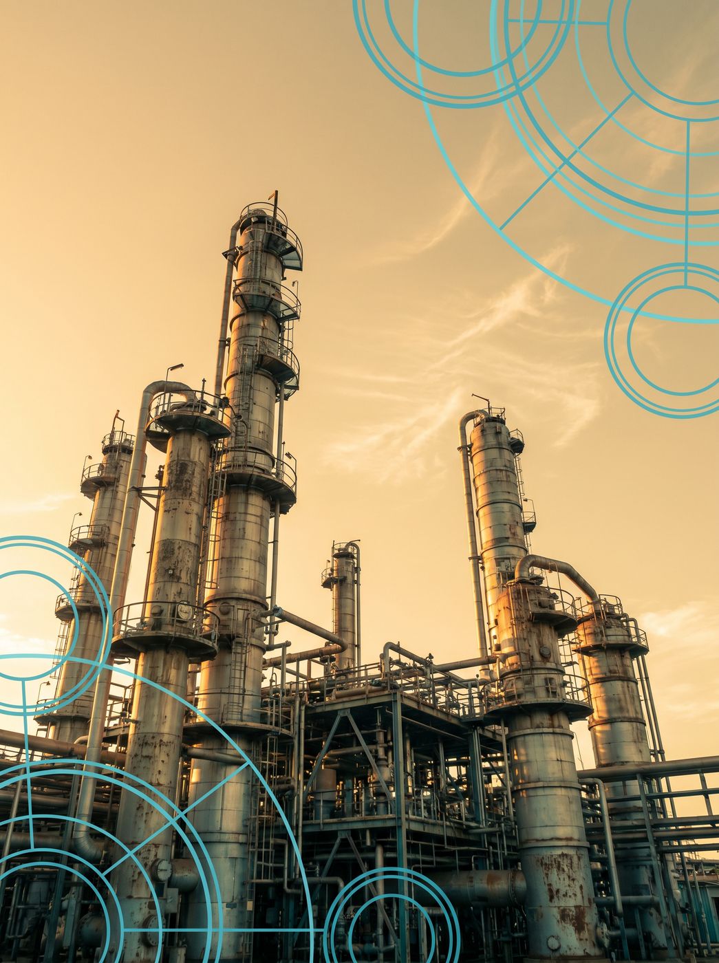 Tall industrial process towers and steel pipework rising against a warm Australian sky.